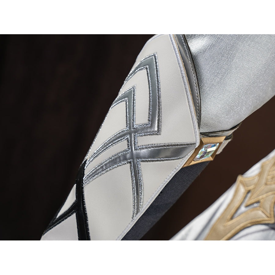 Detail of the silver arm bracer on Aether cosplay costume showing X-pattern stitching and gold diamond gem clasp