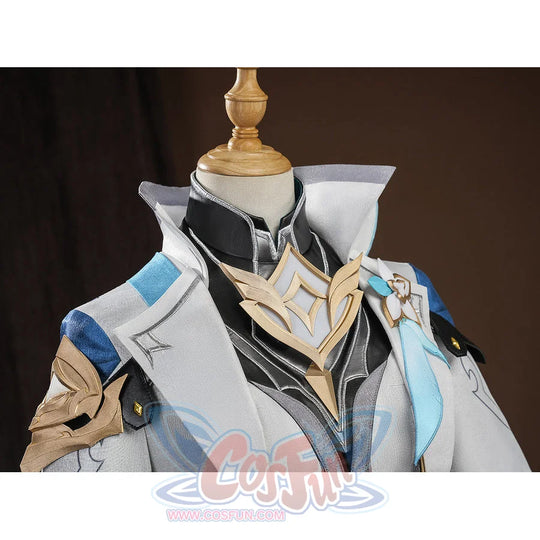 Close-up detail of Aether cosplay costume chest area with gold emblem, black collar, and blue shoulder armor