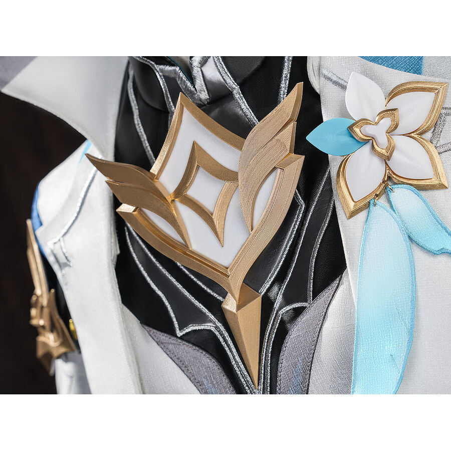 Close-up of Aether cosplay costume accessories: gold diamond chest emblem and white flower brooch with blue ribbon