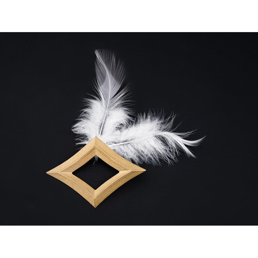 Gold diamond hair clip and white feather hair pin accessories included with the Aether cosplay costume set