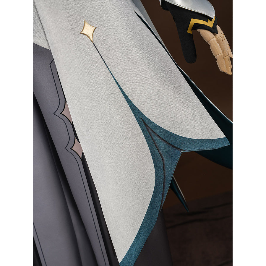 Detail of the lower coat tail on Aether cosplay costume with gold diamond stud, embroidered edge, and teal lining