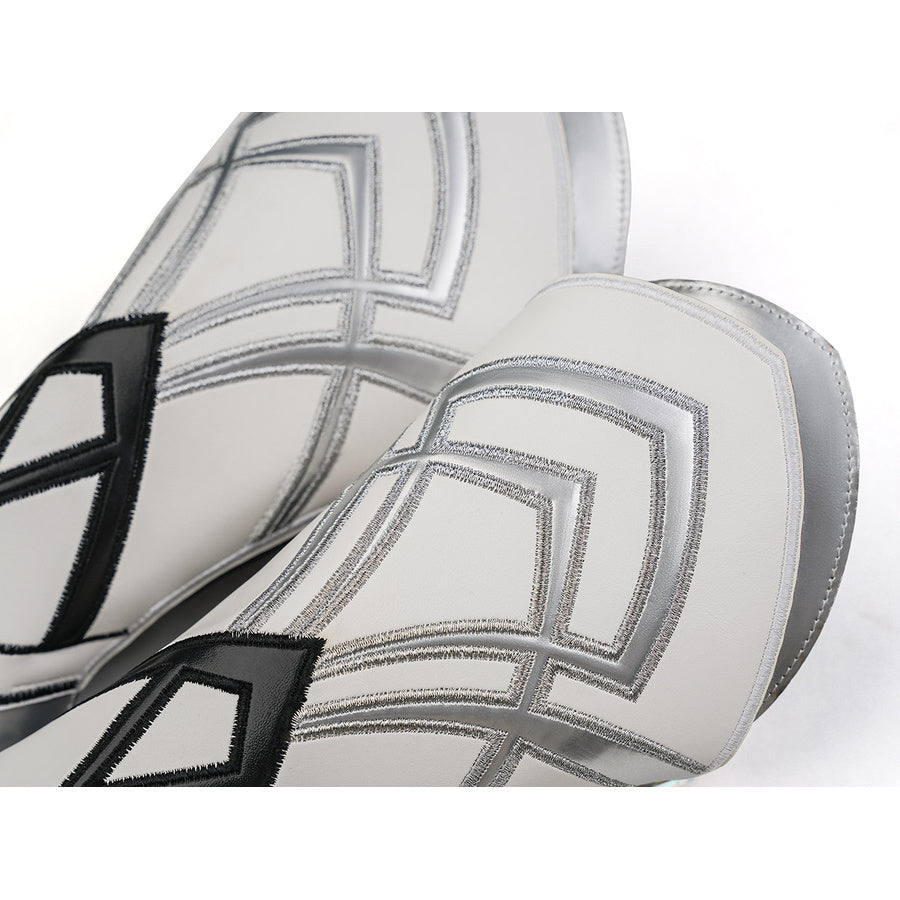 Pair of silver arm bracers from Aether cosplay costume showing geometric square pattern embossed on silver leather