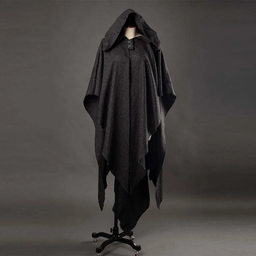 A mannequin showcases a dark gray, hooded Ahsoka cosplay cloak with an uneven hem, mounted on a black stand against a gray background.