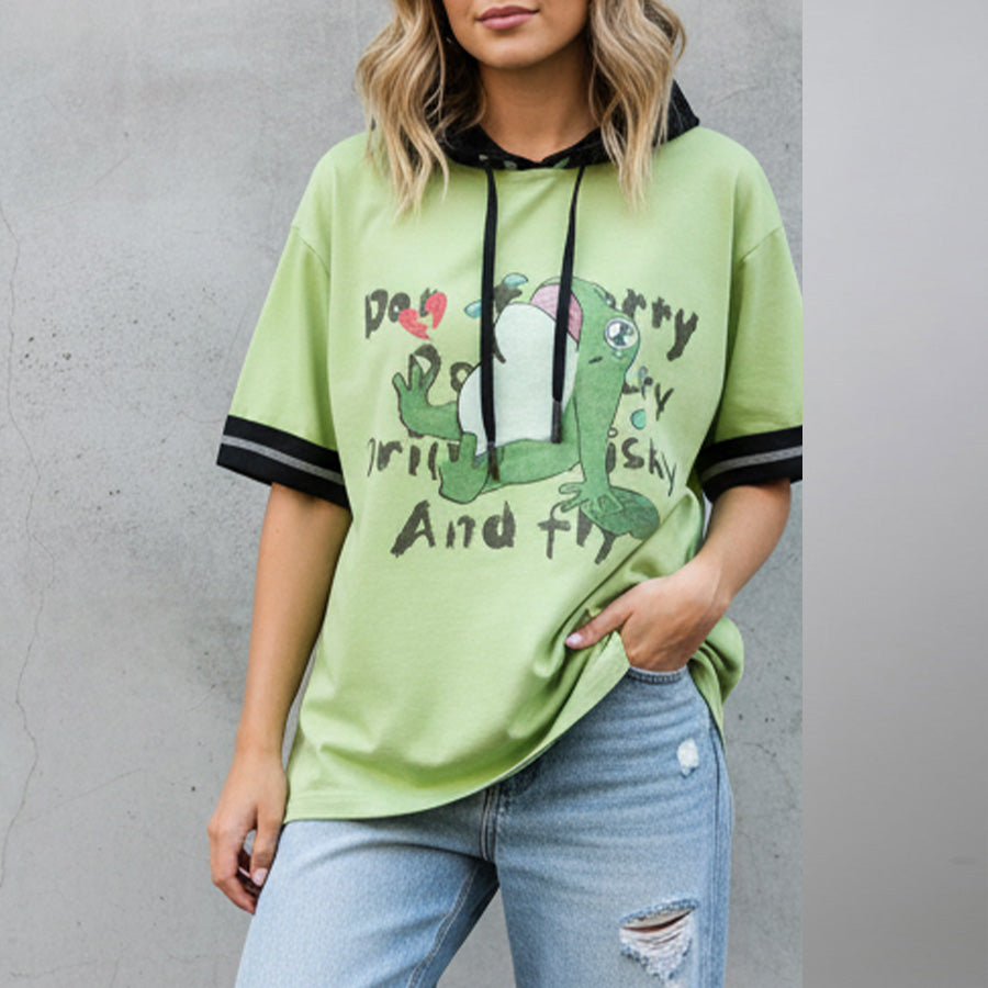 Model wearing green Frog Printed Short Sleeve Hooded Sweatshirt with black hood and trim details