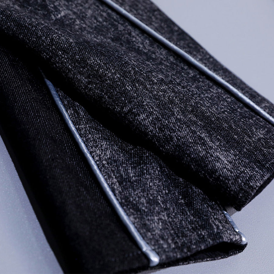 Detail of pants from Alicia cosplay costume showing distressed fabric texture with silver decorative trim accent