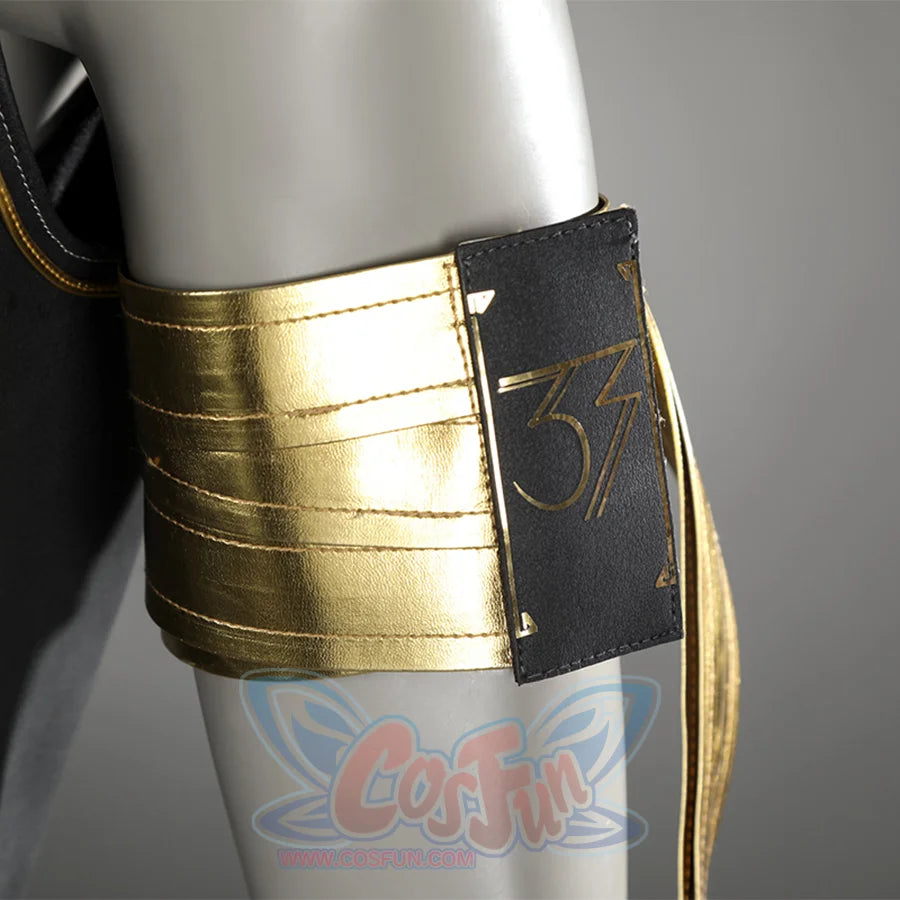 A gold PU leather armband with a black badge bearing the number 