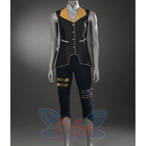 The cropped pants feature metallic decorative bands and gold-trimmed hems.