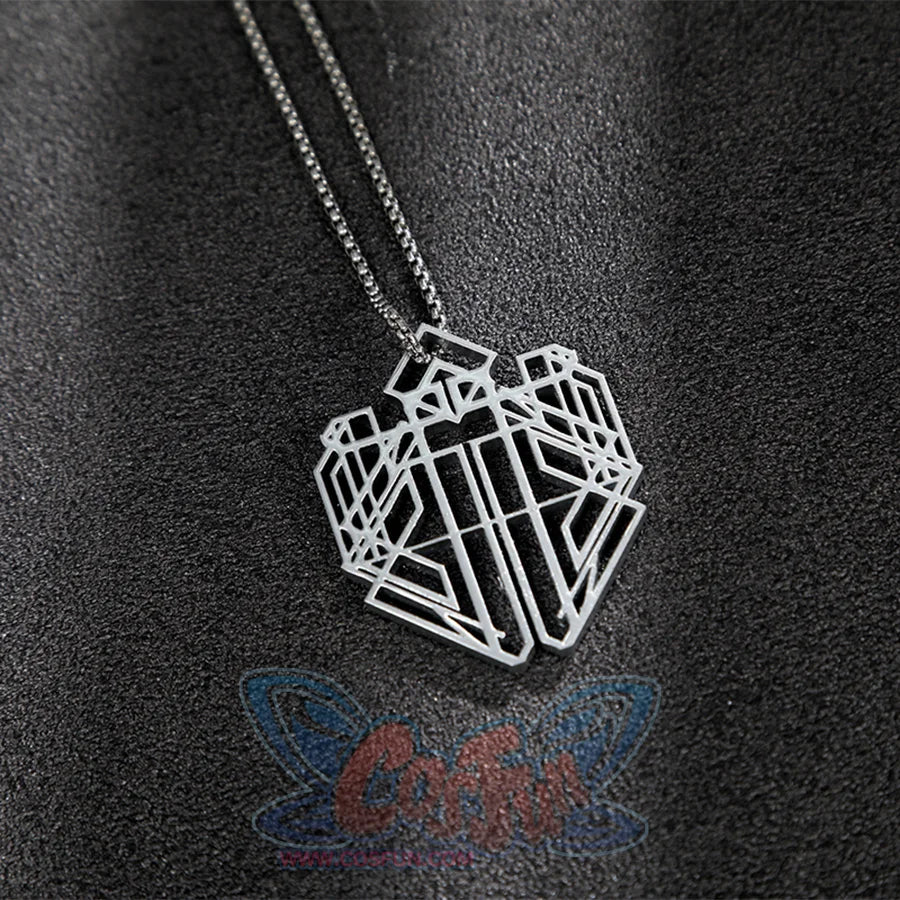 The necklace is entirely silver and has a complex geometric shape.