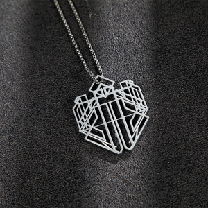 The necklace is entirely silver and has a complex geometric shape.