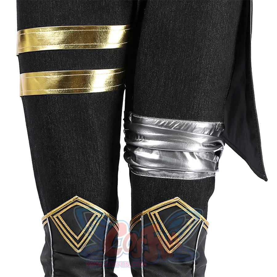 The pants incorporate asymmetric details, golden straps on the left and a silver guard on the right.