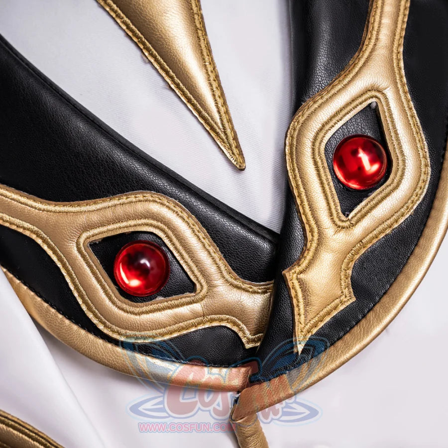 Anime Lelouch cosplay fabric detail traces intricate gold embroidered trim beside glossy red gemstones.