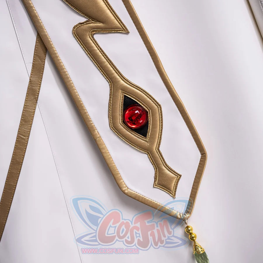 Anime Lelouch cosplay trim detail frames a red jewel in gold beside hanging gold and green bead tassels.