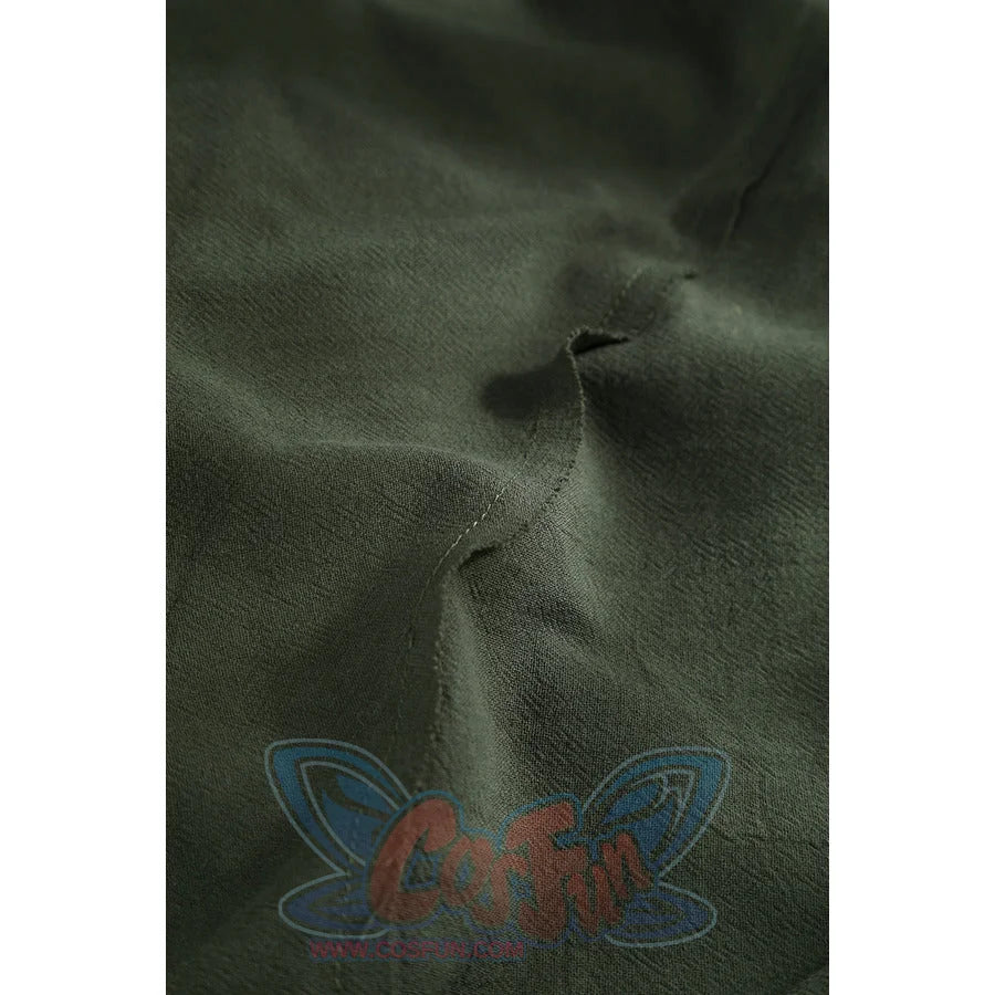 Macro close-up of Dunk cosplay dark green cloak fabric showing wrinkled texture and visible seam line.