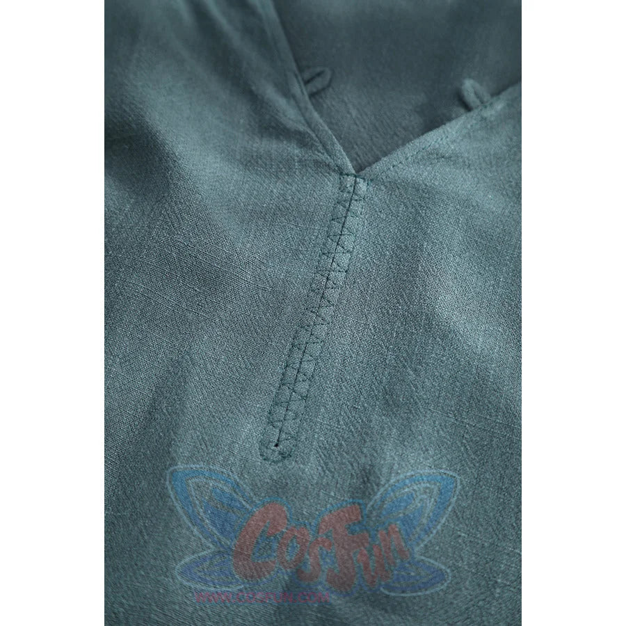 Macro view of Dunk cosplay blue tunic V-neckline showing fine stitching and linen fabric weave texture.