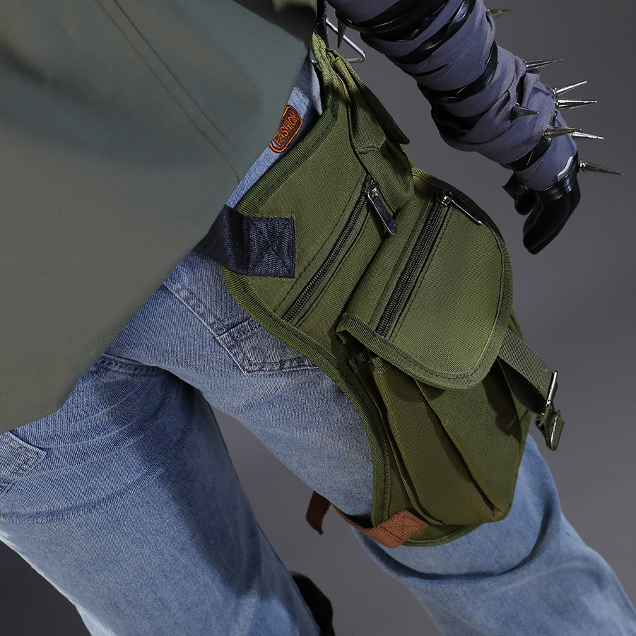 Close-up view of Kyle Crane cosplay costume green waist bag with multiple compartments, orange patch, and wrapped forearm detail