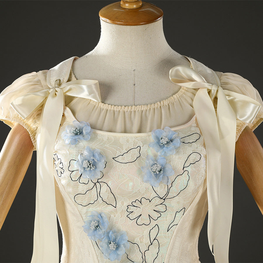 Enid Sinclair cosplay costume bodice close-up with blue floral embroidery and ribbon bows