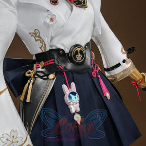 Evanescia cosplay waist view with white jacket, black belt, sakura emblem, navy hakama, pink rabbit charm, and pink tassels.