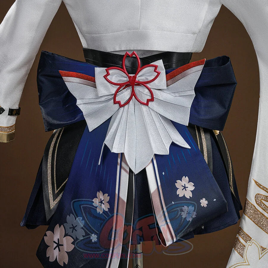Evanescia cosplay back view with white pleated bow, red sakura outline, navy hakama with sakura print, and white jacket.