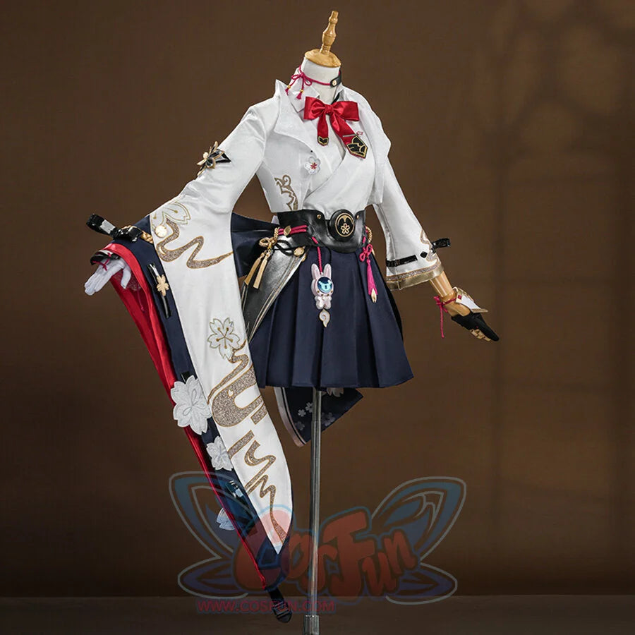 Evanescia cosplay back view displaying white jacket with gold embroidery and navy hakama with sword accessories