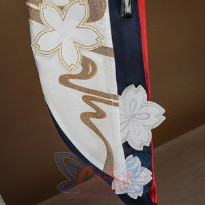 Evanescia cosplay jacket hem with white sakura appliques, gold glitter outlines, and gold wave embroidery on white fabric.
