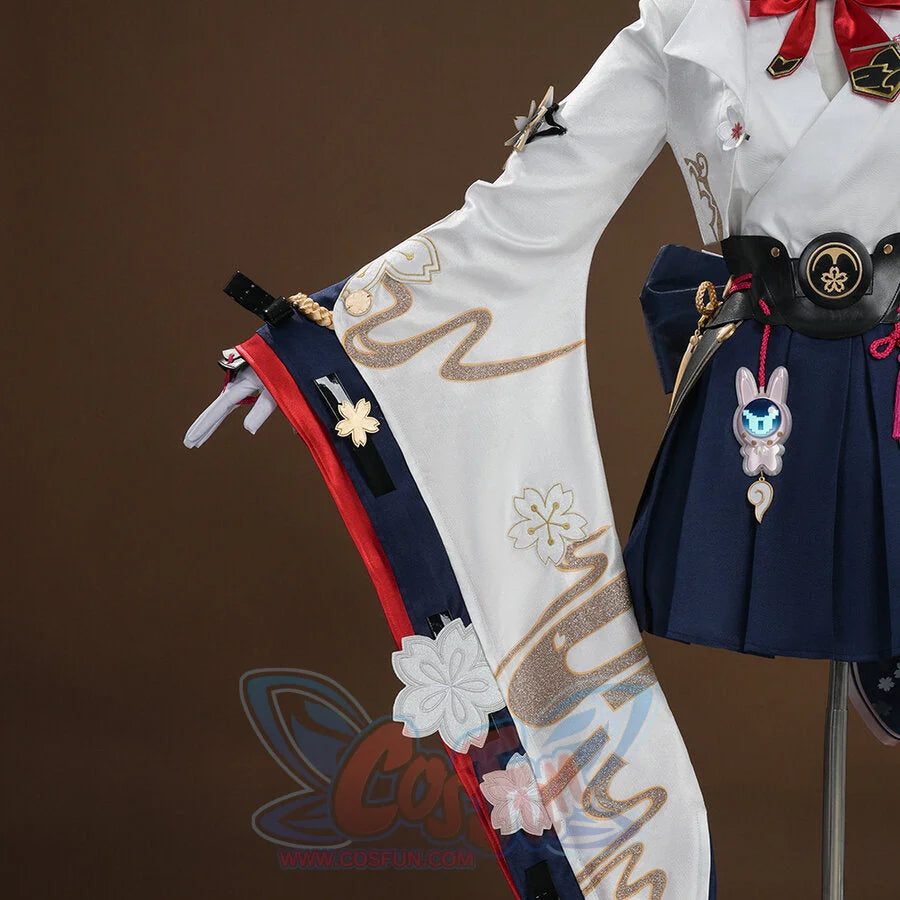 Evanescia cosplay white jacket and sword sheath front view with gold embroidery, navy hakama, and pink rabbit charm.