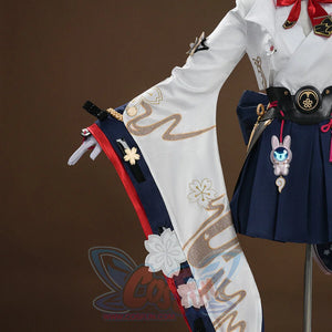 Evanescia cosplay white jacket and sword sheath front view with gold embroidery, navy hakama, and pink rabbit charm.