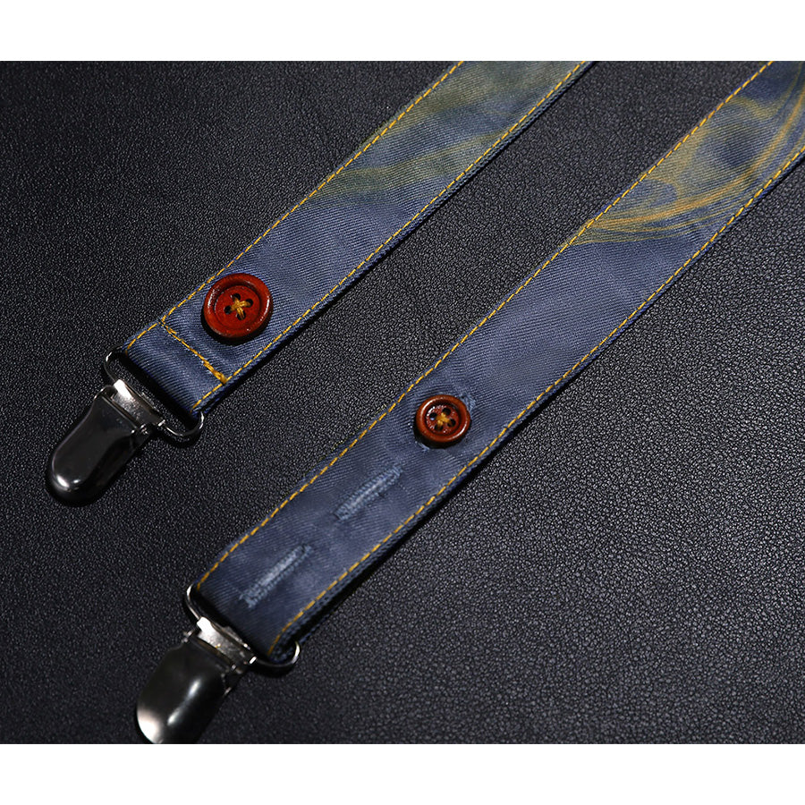 Suspender strap close-up of Clea Dessendre cosplay costume with golden stitching, brown buttons, and metal clips