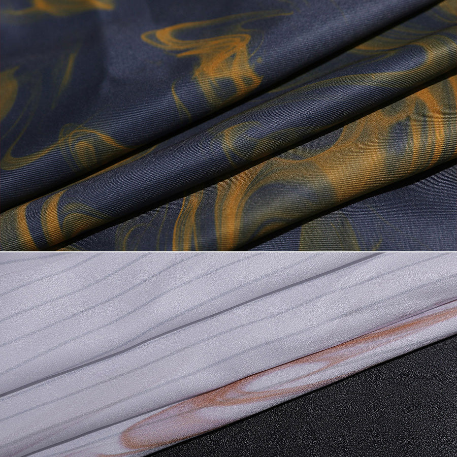 Fabric detail of Clea Dessendre cosplay costume showing blue material with golden bird patterns and white striped textile