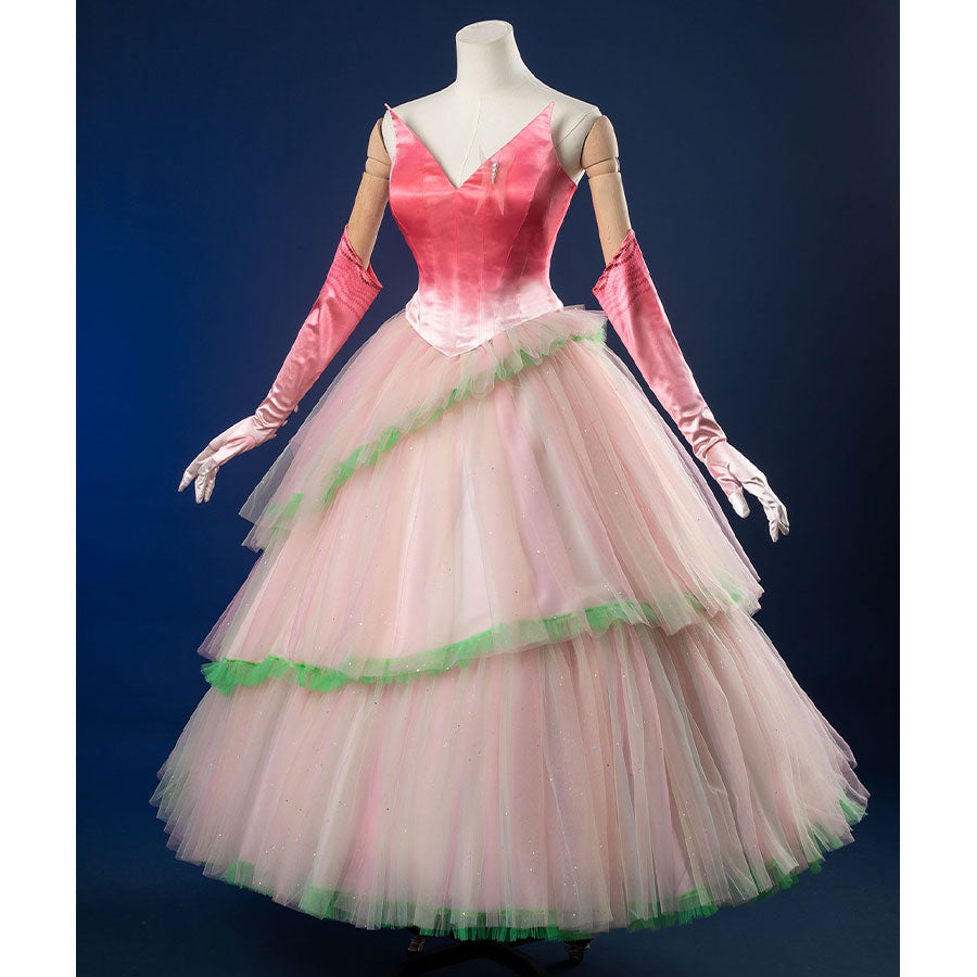 Front view: Glinda Cosplay Costume with sleeveless pink ombre top, layered tulle puff skirt with mint green hem trim, and long pink ombre gloves.