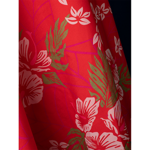 Aerith cosplay red apron printed extreme closeup with pink floral design, costume detail