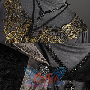Shows close-ups of the gray top’s gold-embroidered, lace-like neckline and the black beaded accessories.