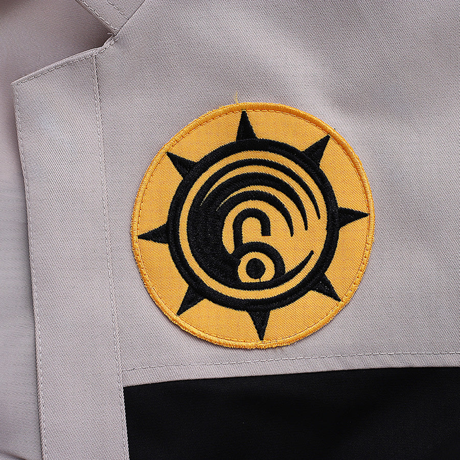 Riyo cosplay costume golden badge patch detail with black spiral embroidery design close-up