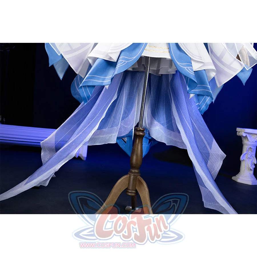 Genshin Impact Columbina cosplay skirt layers white blue-trimmed panels above sheer purple and blue train.