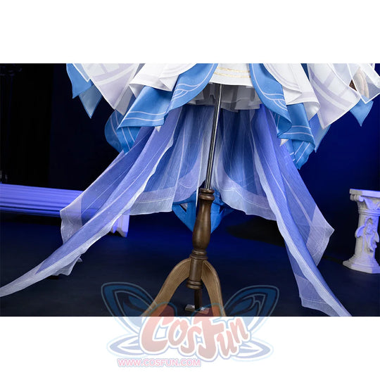 Genshin Impact Columbina cosplay skirt layers white blue-trimmed panels above sheer purple and blue train.