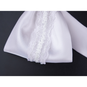 Close-up of FES Columbina cosplay costume white satin bow with delicate lace trim center detail