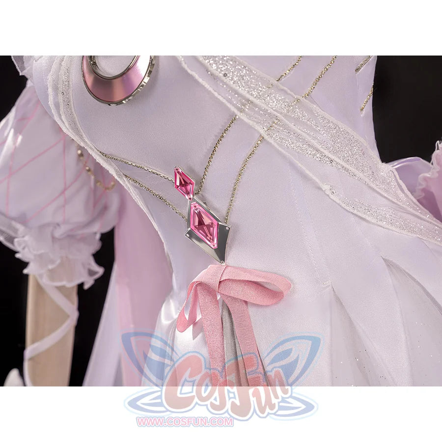 Close-up of FES Columbina cosplay costume waist showing pink gem pendants and ribbon bow detail