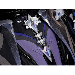 Flins cosplay costume chest detail showing silver cross brooch with purple gem on black and purple vest