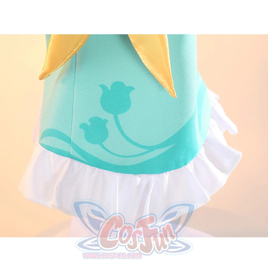 Genshin Impact Yaoyao cosplay vestment sets white ruffled hem against turquoise floral print and yellow neck scarf.