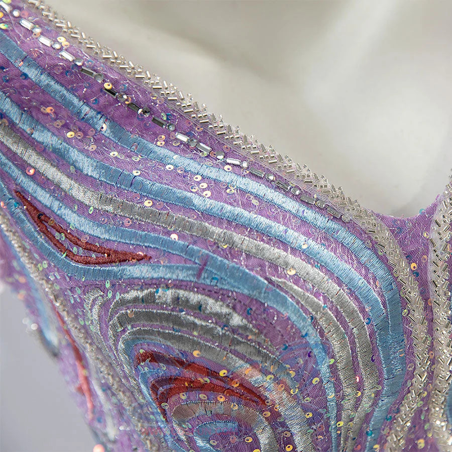 Glinda cosplay dress embroidery detail with multicolored threads, sequins, and beaded edging