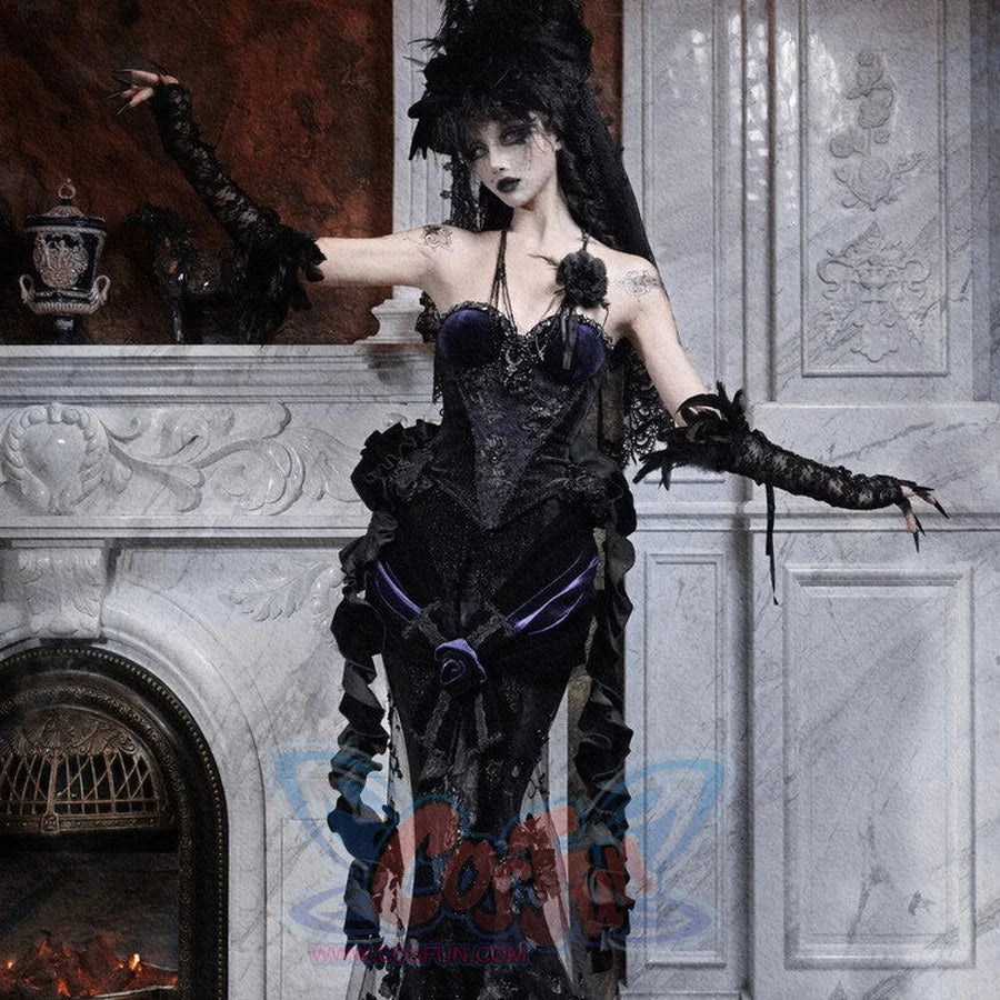 Model in a gothic black beaded corset with embroidered rose, feathered hat and long veil, arms extended outward.