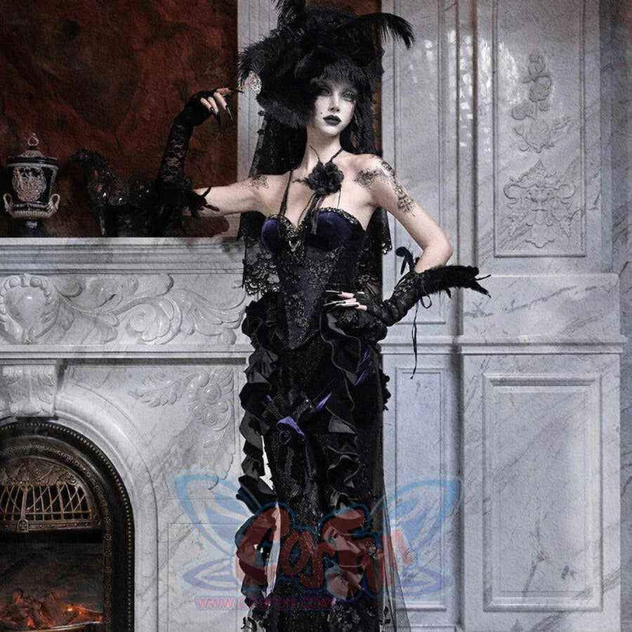 Model wearing a gothic black lace mermaid skirt with beaded embroidery, posed near a marble fireplace.