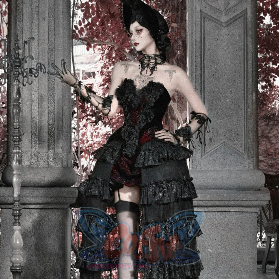 Full-body view of model in gothic corset bustier top, layered ruffled skirt with red brocade, hat, and garter stockings.