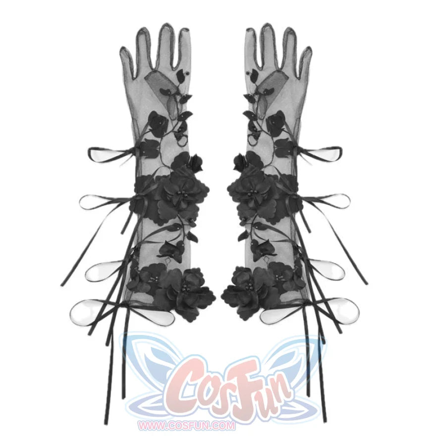 Long black sheer gloves on white background, decorated with 3D floral appliques and ribbon bow details along the length.