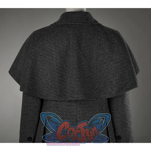 The whole coat with a shawl design on the shoulders,  the fabric looks textured and has a plaid pattern, giving it a retro feel.