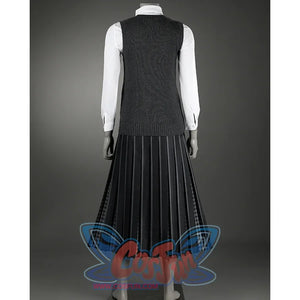 A knitted vest and a collared shirt give the overall style a formal feel, paired with a black pleated long skirt.