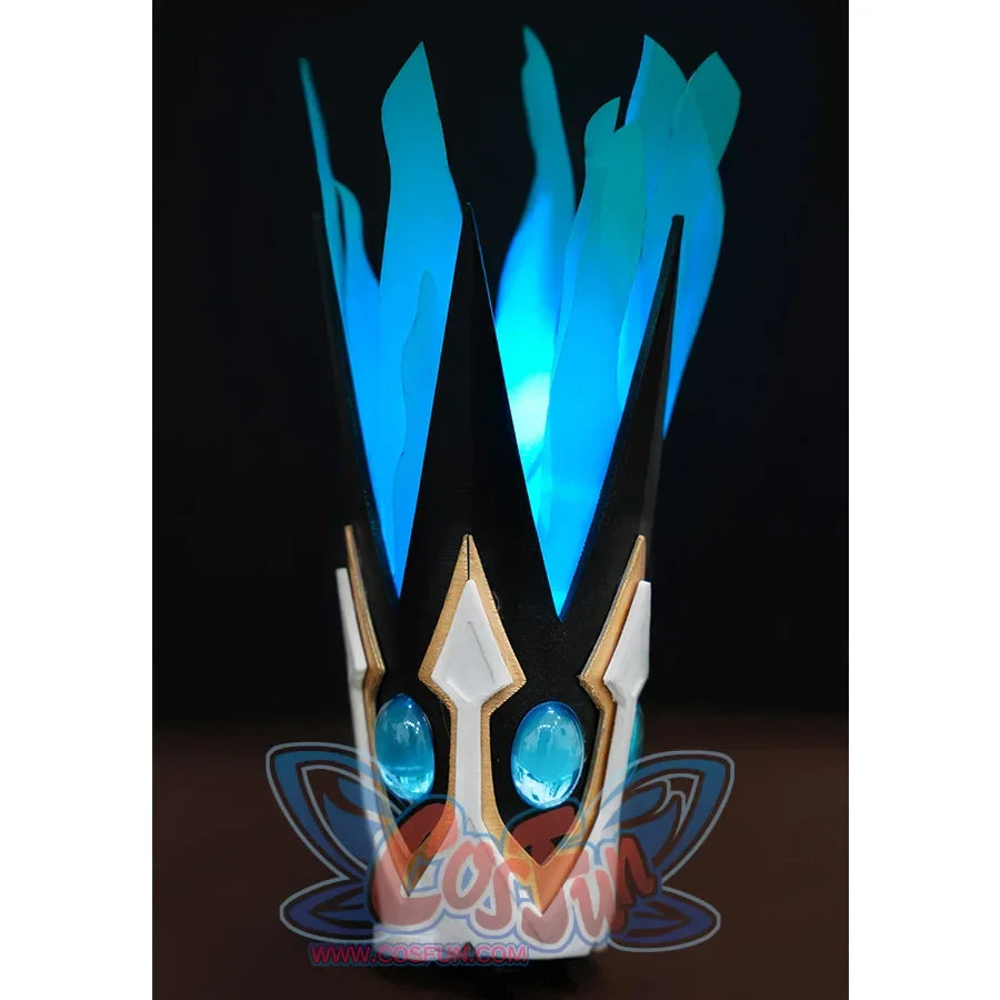 The crown&#39;s main body is black, with gold outline and white base, blue gems are embedded in black structure, and there is a blue feather-like material on the top.