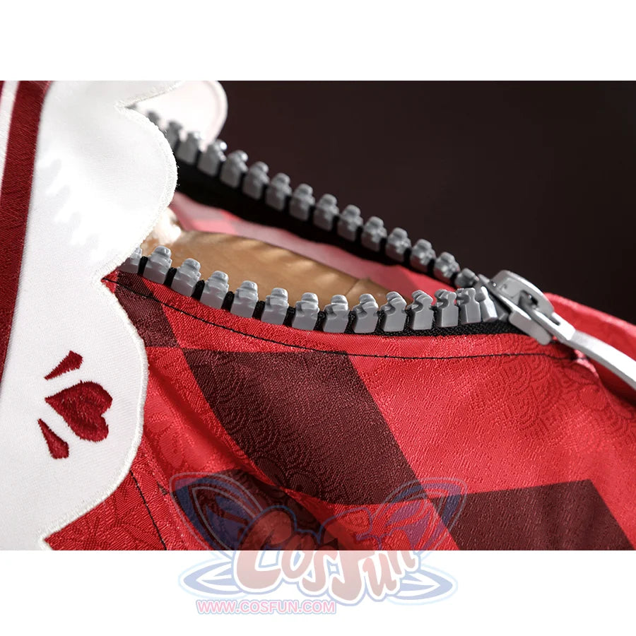 Sparkle cosplay sleeve detail showing zipper trim on red and checkered pattern fabric