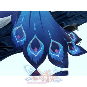 Yao Guang cosplay dress hem detail with navy blue feather pattern and teal-pink decorative accents