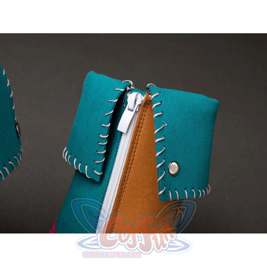 Stranger Things Holly Wheeler cosplay boot detail centers a white zipper between teal and tan panels with grey blanket.