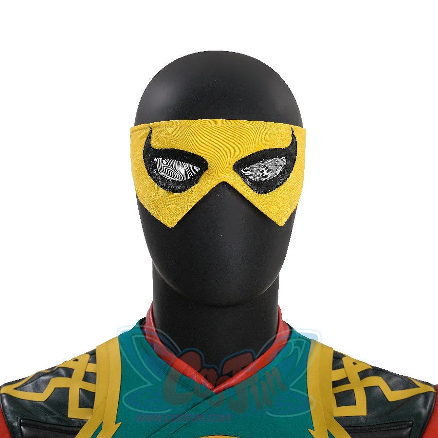 Displays the head portion of the Sword Master Iron Fist outfit, with a black mannequin wearing a yellow, textured mask and the upper-body armor’s intricate gold-accented patterns.